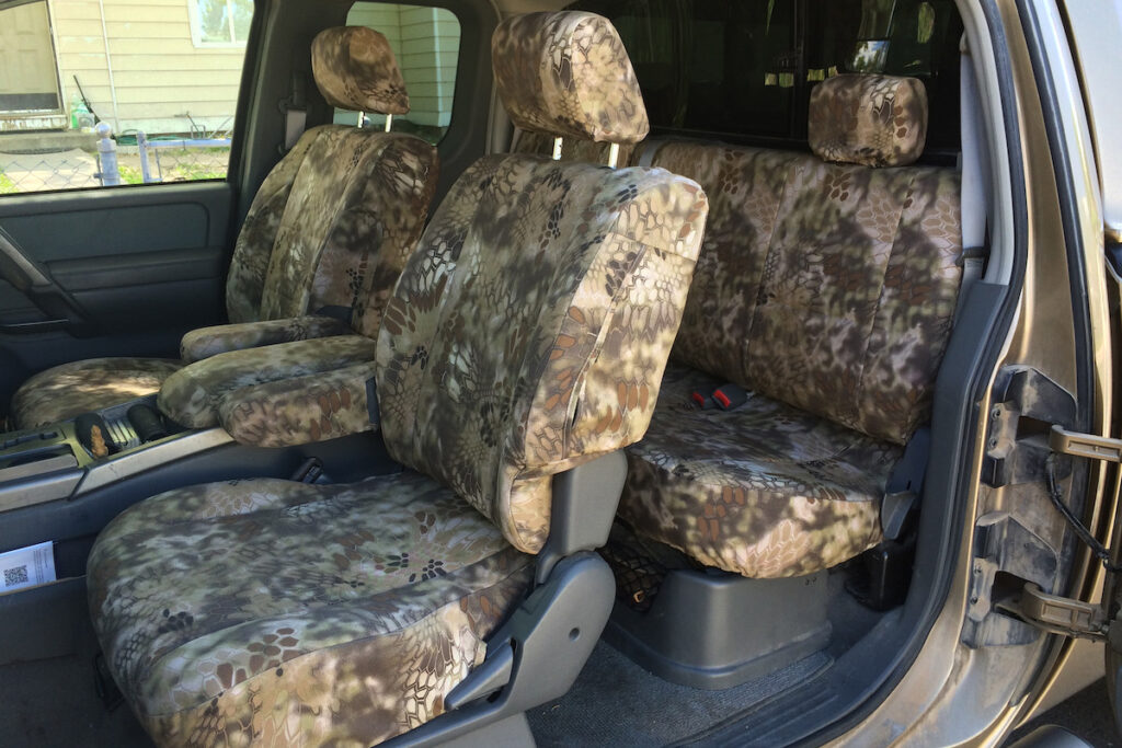 2005 Nissan Titan front Kryptek Highlander Seat Covers with custom-fit front and rear seating