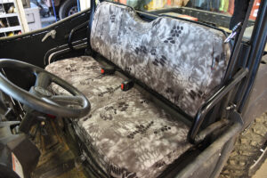 2015 Polaris Ranger front bench seat covered in Kryptek Raid camouflage canvas