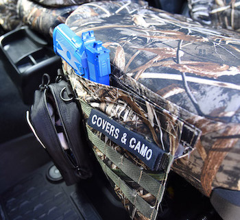 Covers and Camo MOLLE Poclet on the 2021 RAM 2500. Seat covers included are the Realtree Max-5 insert and trim.