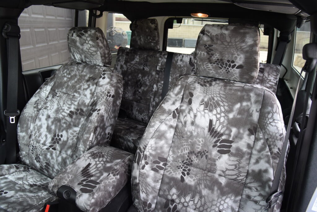 2015 Jeep Wrangler front Kryptek Raid seat covers with matching console cover