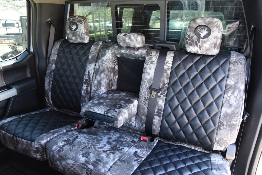 2018 Ford F-350 rear seat covers with Black Ostrich Diamond inserts and Kryptek Raid camouflage trim