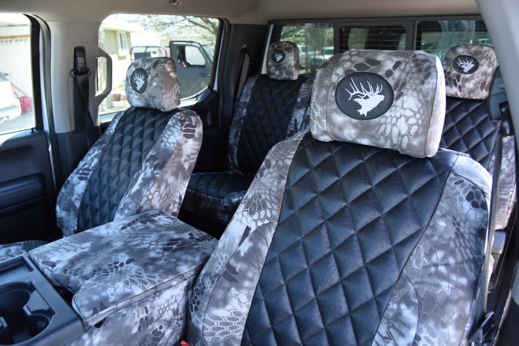 2018 Ford F-350 front seat covers with Black Ostrich Diamond inserts and Kryptek Raid camouflage trim