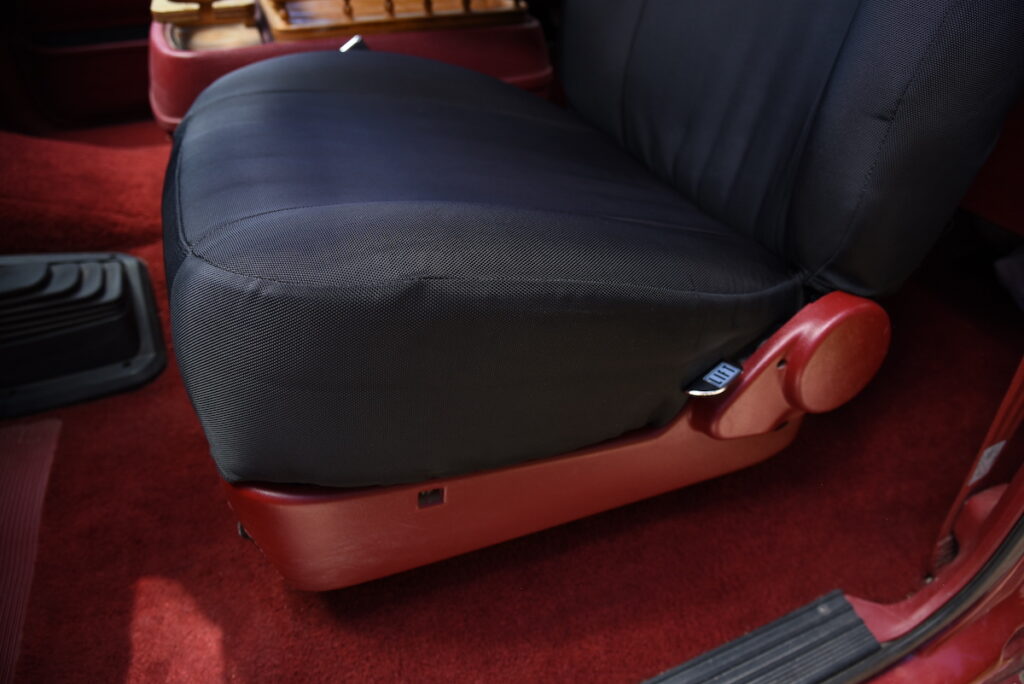 1991 Ford F-250 front seat cushion fitted with black ballistic canvas seat cover