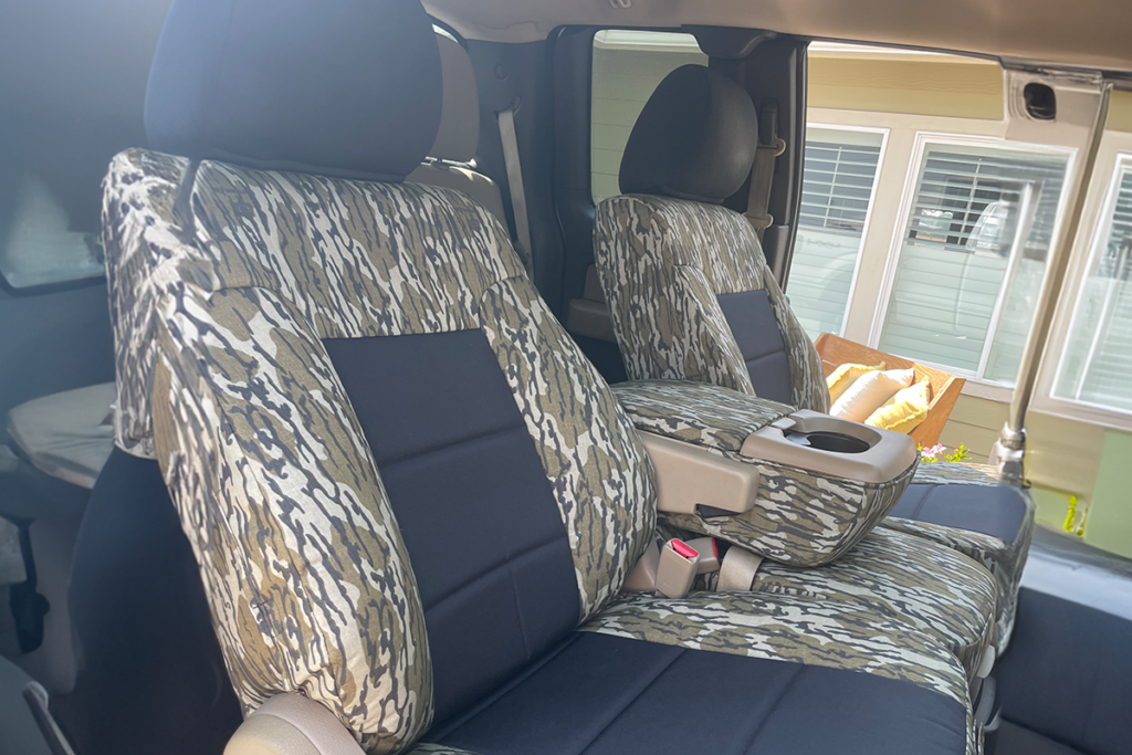 Console and front seat view of 2008 Ford F-150 seat covers in Black HD1000 canvas and Mossy Oak Bottomland camouflage