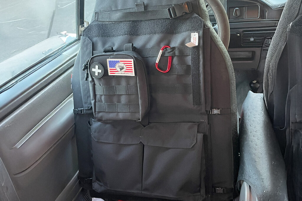 1996 Ford F-250 seat covers in Red Ostrich E11 Diamond Leatherette and Black Ostrich with rear seat organizer
