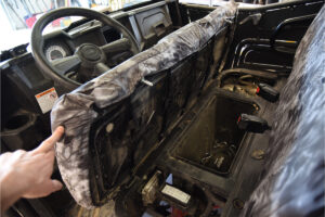 2015 Polaris Ranger front bench seat covered in Kryptek Raid camouflage canvas