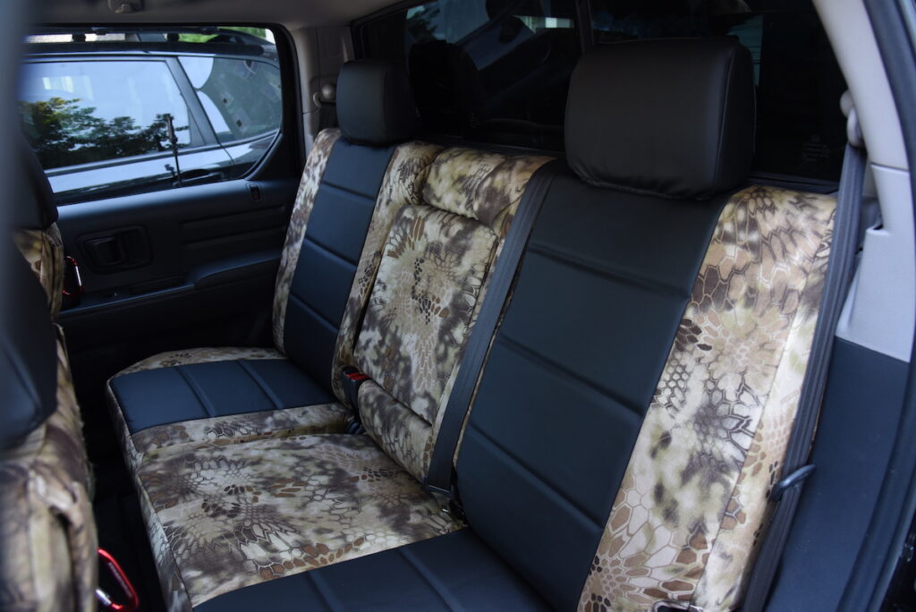 2013 Honda Ridgeline front seating area with Black Sof-Touch and Kryptek Highlander seat covers