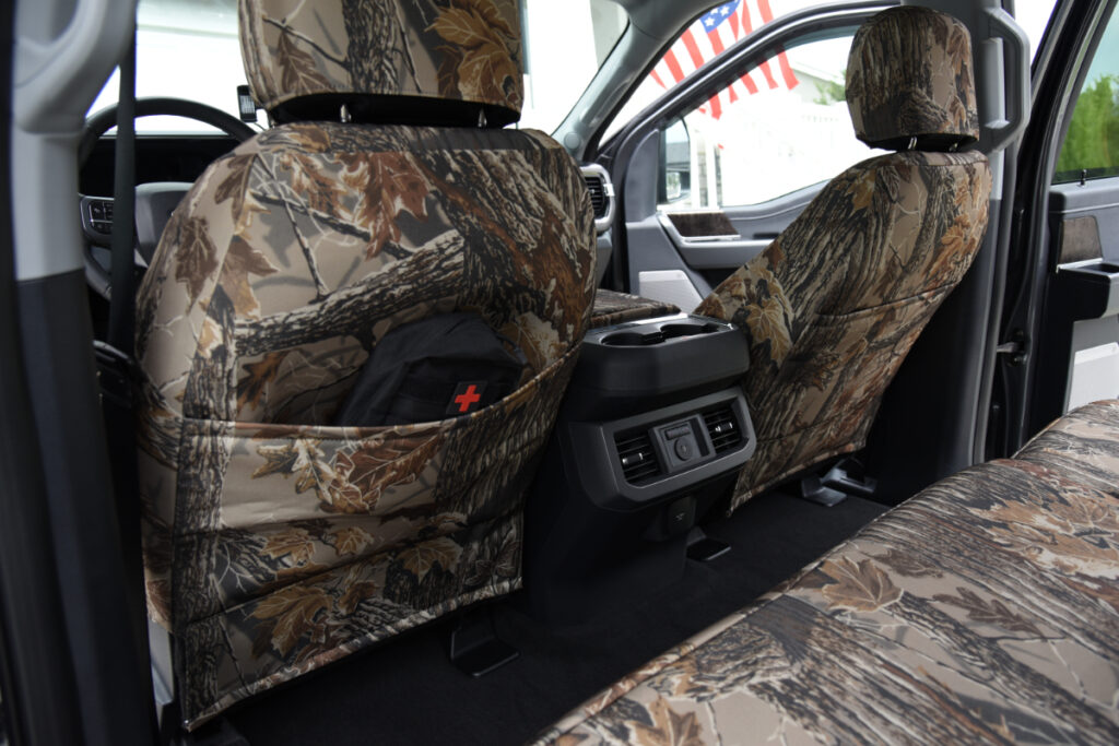 2026 Ford F-350 front seat back with Realtree Xtra Grey camo seat cover and storage pocket