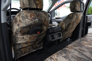 2026 Ford F-350 front seat back with Realtree Xtra Grey camo seat cover and storage pocket