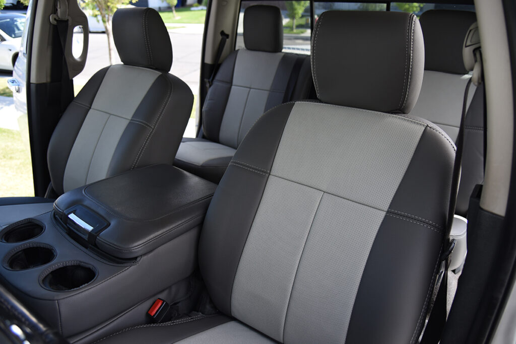 2018 RAM 3500 front genuine leather seat covers with Light Gray inserts, Dark Gray trim, and Light Gray stitching