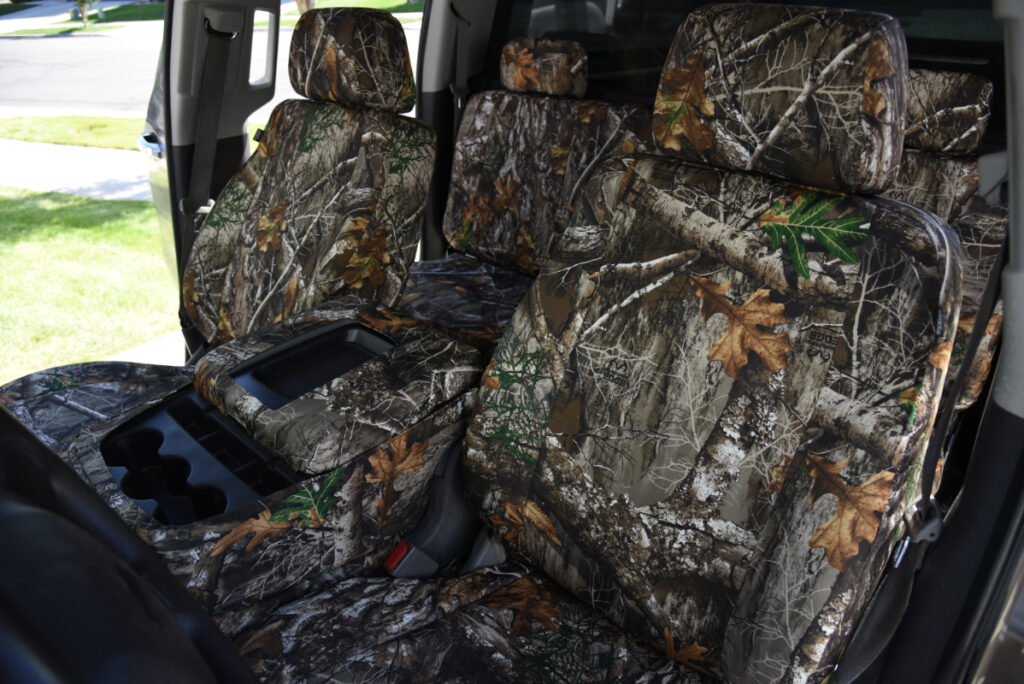2015 Chevy Silverado 1500 front cabin with Realtree Edge seat covers and center console