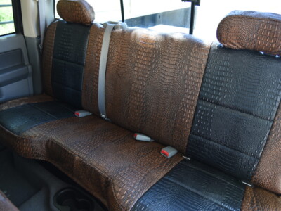 <b>
2006 RAM 3500
</b>
<br>
Insert: Midnight Croc E43 (Sim. Leather)
</br>Trim: Java Croc E42 (Sim. Leather)
</br>Product: Exotic - Gold Series | Covers and Camo