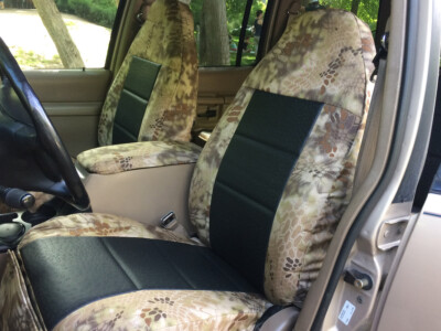 1997 Ford Explorer Black Ostrich E01 leatherette seat covers with Kryptek Highlander C70 canvas trim front seat view