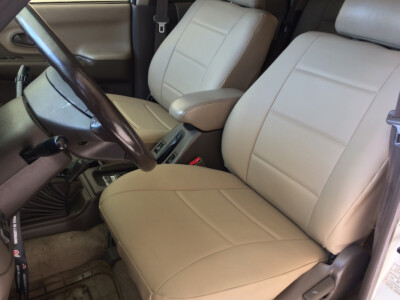 1998 Mitsubishi Montero front leatherette seat covers with Sandstone Sof-Touch inserts and Sandstone Sof-Touch trim