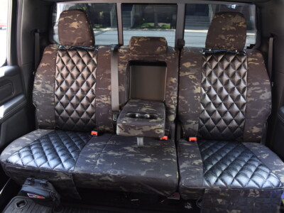 <b>2021 RAM 1500
</b><br>
Insert: Black Ostrich E01 Diamond (Sim. Leather)
</br>Trim:  MultiCam Black C80 (Canvas)
<br> Product: Camo - Gold Series </br> | Covers and Camo
