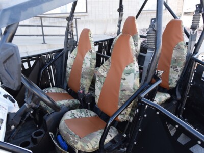 2012 Polaris RZR front UTV camo seat covers with Saddle Ostrich simulated leather inserts and MultiCam Original canvas trim