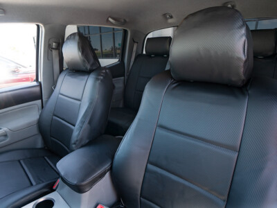 2011 Toyota Tacoma front Black Carbon Fiber leatherette seat covers with matching console cover