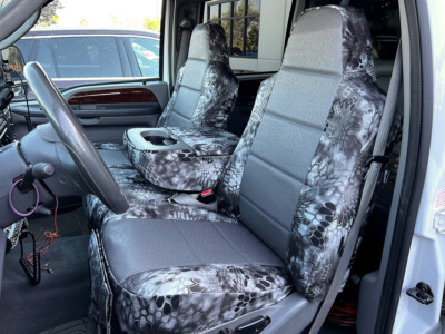 <b>
2003 Ford F350
</b>
<br>
Insert: Charcoal Ostrich E26 (Sim. Leather)
</br>Trim: Kryptek Raid C72 (Canvas)
<br>Product: Camo - Gold Series </br> | Covers and Camo