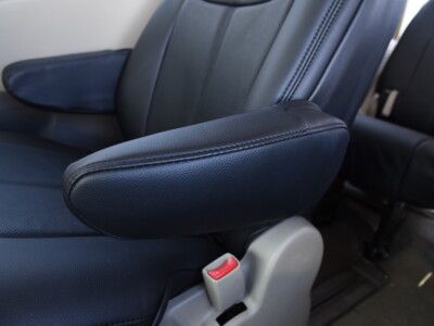 2012 Toyota Sienna armrest cover with Black Vinyl trim with Black Perforated Leather seat cover material and Black Stitch
