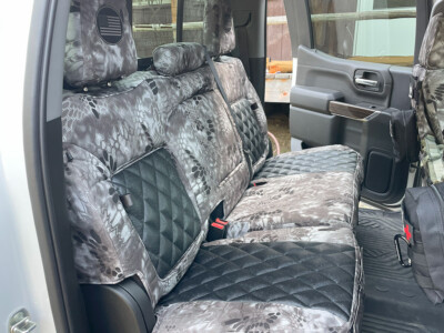 <b>
2022 Chevy Silverado 1500
</b>
<br>
Insert: Black Ostrich E01 Diamond (Sim. Leather)
</br> Trim: Kryptek Raid C72 (Canvas)
</br> Product: Camo - Gold Series | Covers and Camo