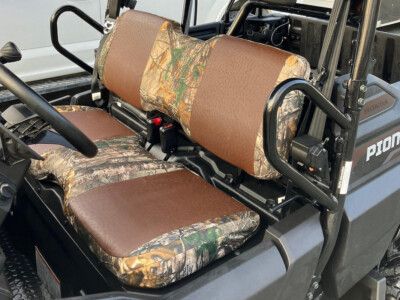 2022 Honda Pioneer front bench seat covers with Brown Ostrich inserts and Realtree Xtra camo trim