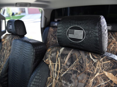 Headrest detail for GMC Sierra seat covers in Realtree Max-7 and Midnight Croc