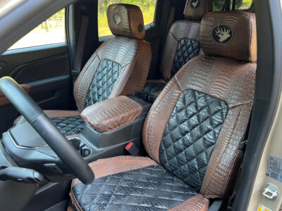 2024 GMC Canyon front Alligator seat covers with Midnight Croc Diamond inserts and Java Croc trim