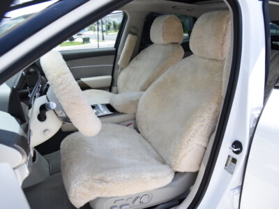 2023 Genesis GV60 front Sand (Pearl) sheepskin seat covers with matching sheepskin steering wheel cover