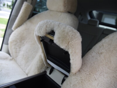 2023 Genesis GV60 front Sand (Pearl) sheepskin seat covers with matching sheepskin steering wheel cover