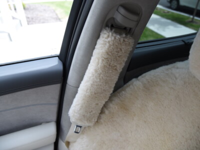 2023 Genesis GV60 front Sand (Pearl) sheepskin seat covers with matching sheepskin steering wheel cover