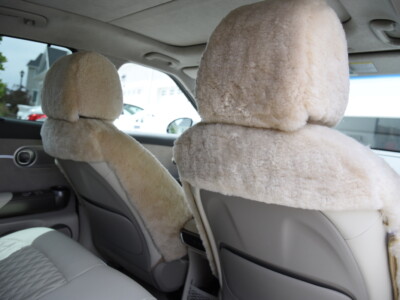 2023 Genesis GV60 front Sand (Pearl) sheepskin seat covers with matching sheepskin steering wheel cover