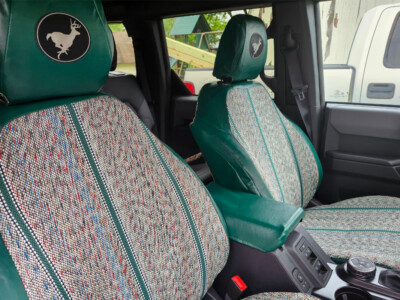 2024 Ford Bronco Green Saddle Blanket front seat cover close-up showing fabric texture and custom fit