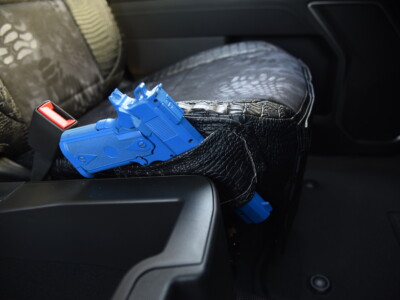 2025 GMC Sierra 3500 Kryptek Typhon seat cover with Midnight Croc trim and pistol holster