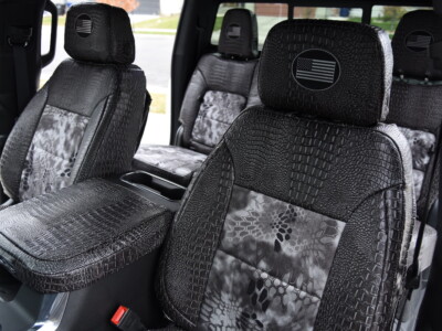 <b>2025 Chevy Silverado 2500
</b><br>
Insert: Kryptek Raid (Canvas)
</br>Trim: Ebony Croc (Sim. Leather)
<br>Product: Exotic - Gold Series </br> | Covers and Camo