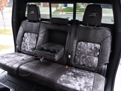 <b>2025 Chevy Silverado 2500
</b><br>
Insert: Kryptek Raid (Canvas)
</br>Trim: Ebony Croc (Sim. Leather)
<br>Product: Exotic - Gold Series </br> | Covers and Camo