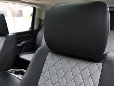2022 RAM 1500 | Light Gray Diamond | Black Faux Leather 2022 RAM 1500 front headrest with black faux leather and gray diamond insert