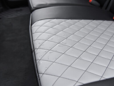 2022 RAM 1500 | Light Gray Diamond | Black Faux Leather Light Gray Diamond faux leather seat surface close-up inside a 2022 RAM 1500