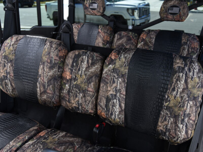 2026 Can-Am Defender | Midnight Croc | Mossy Oak NB Country 2026 Can-Am Defender front UTV Exotic seat covers with Midnight Croc inserts and Mossy Oak NB Country trim