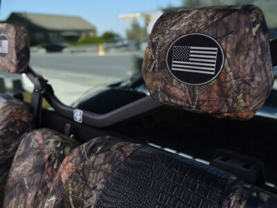 2026 Can-Am Defender | Midnight Croc | Mossy Oak NB Country 2026 Can-Am Defender headrest logo with Mossy Oak NB Country trim and Midnight Croc seat cover