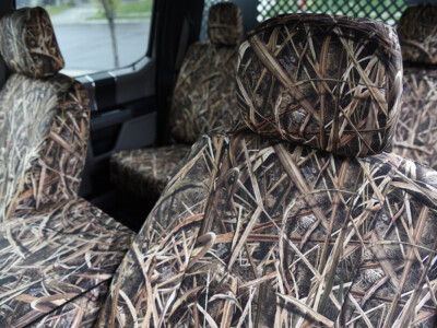 Front seat close-up of 2019 Ford F-550 seat covers in Mossy Oak Shadow Grass Blades camouflage