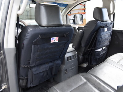 2006 Nissan Titan front leatherette seat backs with Black Sof-Touch trim, MOLLE panels and storage pockets