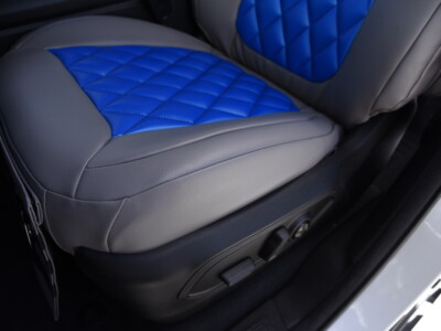2023 Jeep Grand Cherokee armrest cover beside Blue Leatherette Diamond and Medium Gray Sof-Touch seat cover